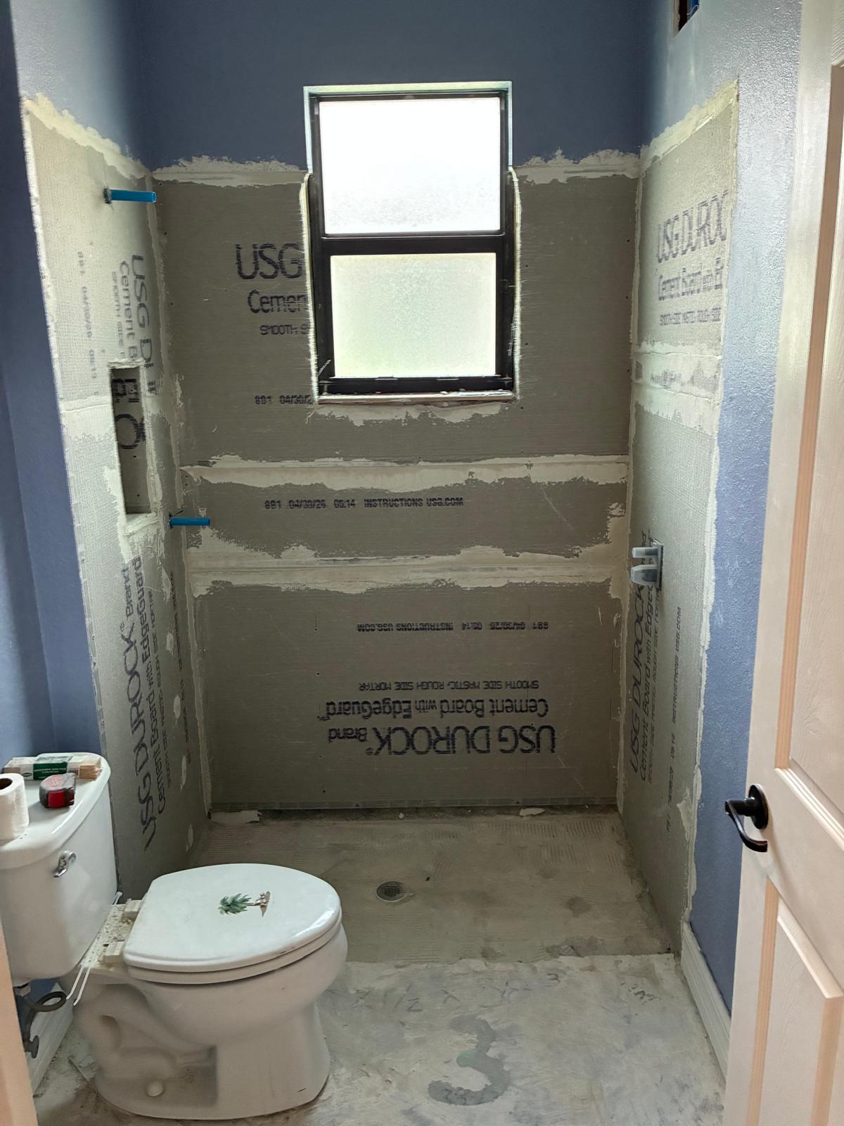 Shower waterproofing with cement board during bathroom gut renovation