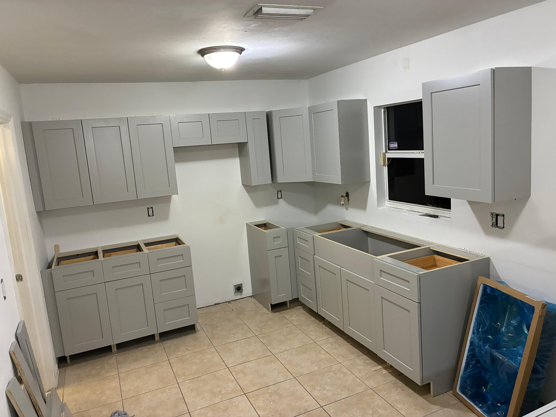 Gray cabinet installation with upper and lower cabinets