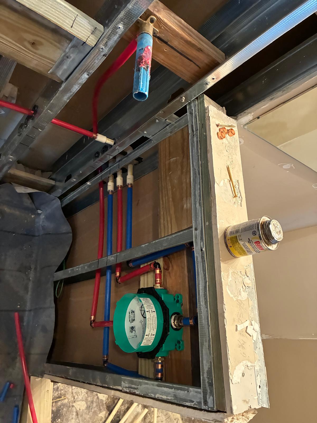 Shower plumbing rough-in by licensed Naples shower remodelers